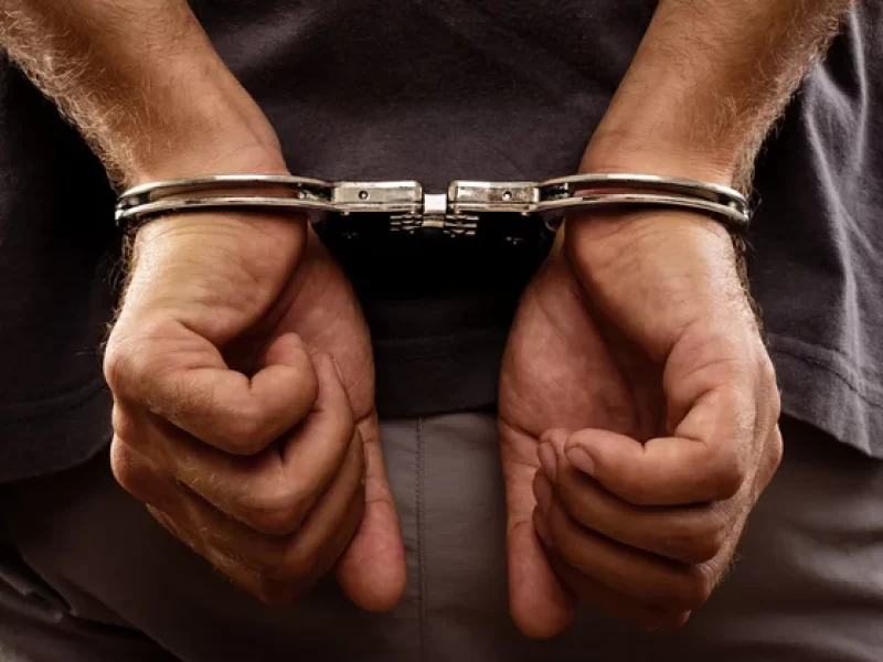 depositphotos_28109403-stock-photo-arrested-man-handcuffed-hands-at